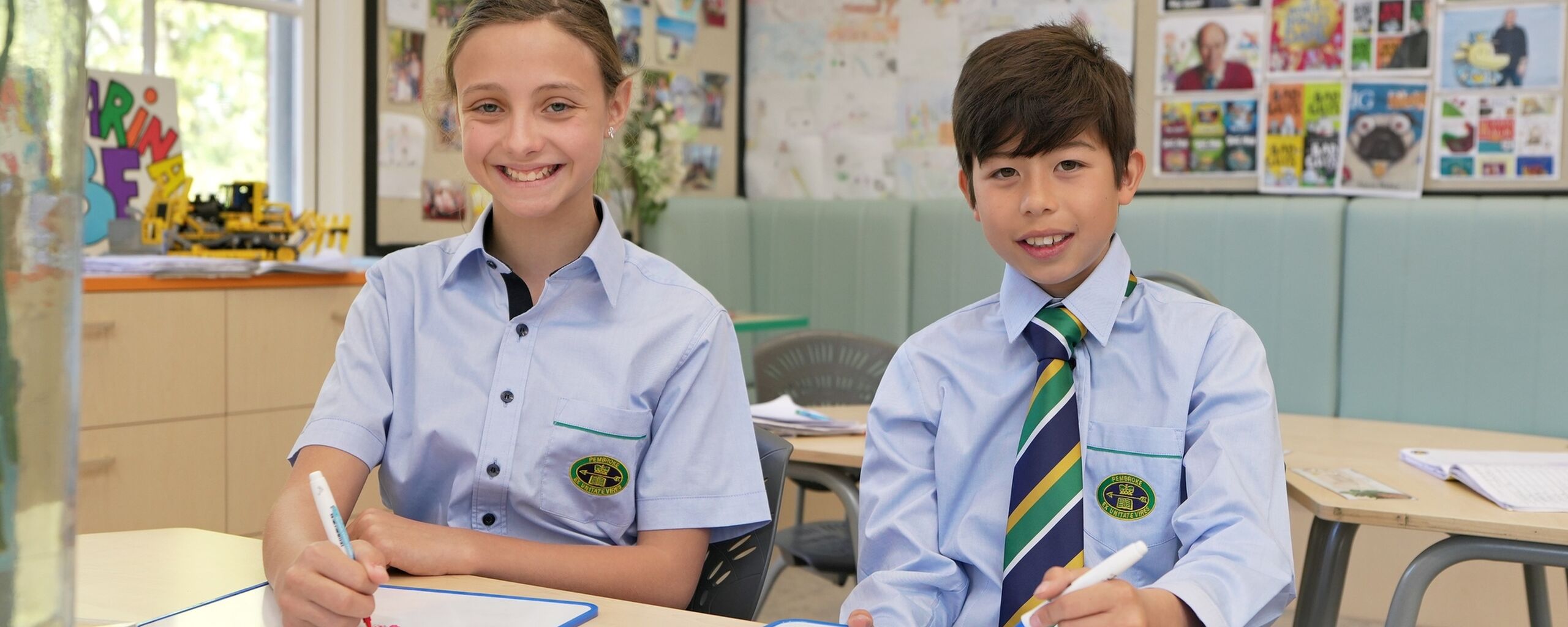JS boy and girl drawing at desk
