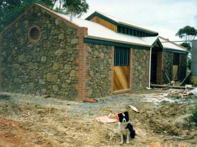 Construction of ablution block at Old Watalunga nearing completion in November 1989. Featuring the stonemason's assistant "Jess the dog".