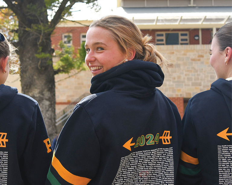 Female senior students in class sweatshirts