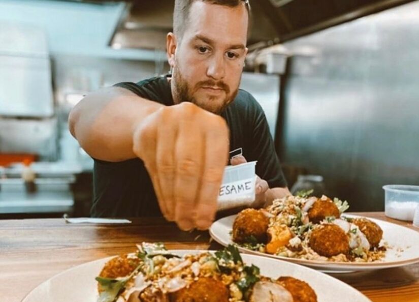 Sam Worrall-Thompson plating up for Kitchen Catering by Sam